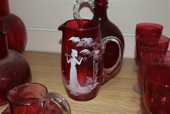 A collection of cranberry and Mary Gregory style glass (11)